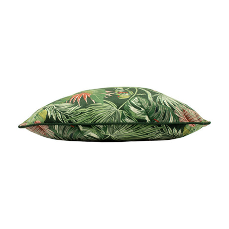 Side view of the Amazon Creatures Reversible Velvet Cushion in jade, showing a green velvet-feel fabric printed with tropical leaves and pink blooms, on a white background.