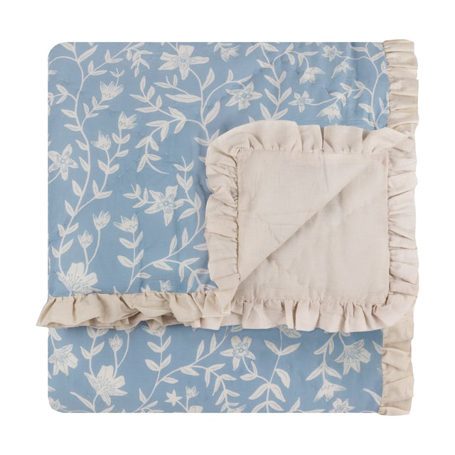 Amelia Ditsy Cotton Bedspread in Delph Blue, folded to show floral quilted front and plain cream reverse with gathered frill trim, on a white background.