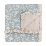 Amelia Ditsy Cotton Bedspread in seafoam, diamond-quilted cotton throw with small floral print and ruffled beige trim, folded on a white background.