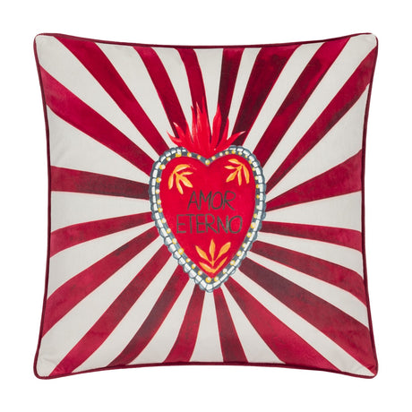 Amor Eterno velvet cushion in red and white, featuring a hand-painted flaming heart with "Amor Eterno" text, radiating stripe design and piped edge trim, shown on a plain white background.