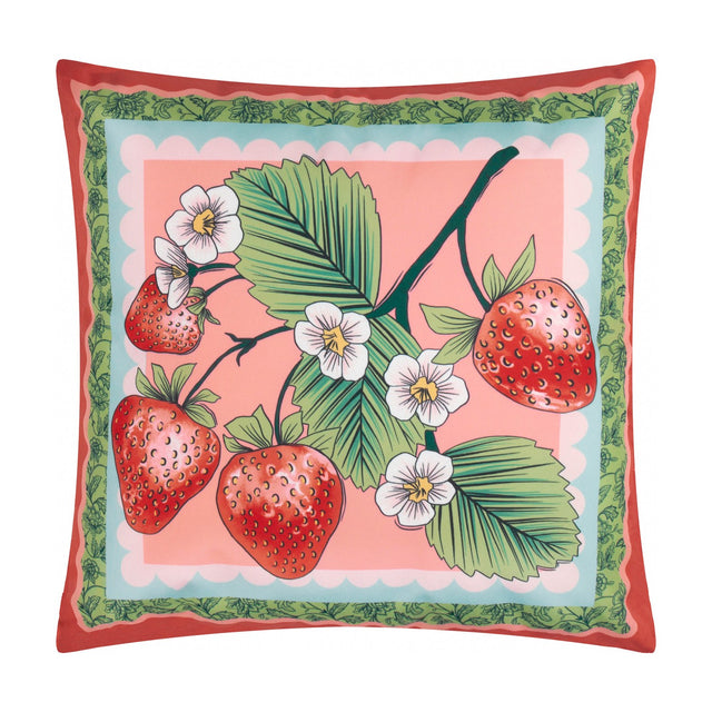 Square reversible polyester cushion with red piping, coral-pink face printed with strawberries, white flowers and leaves within a scalloped green border, on a white background.
