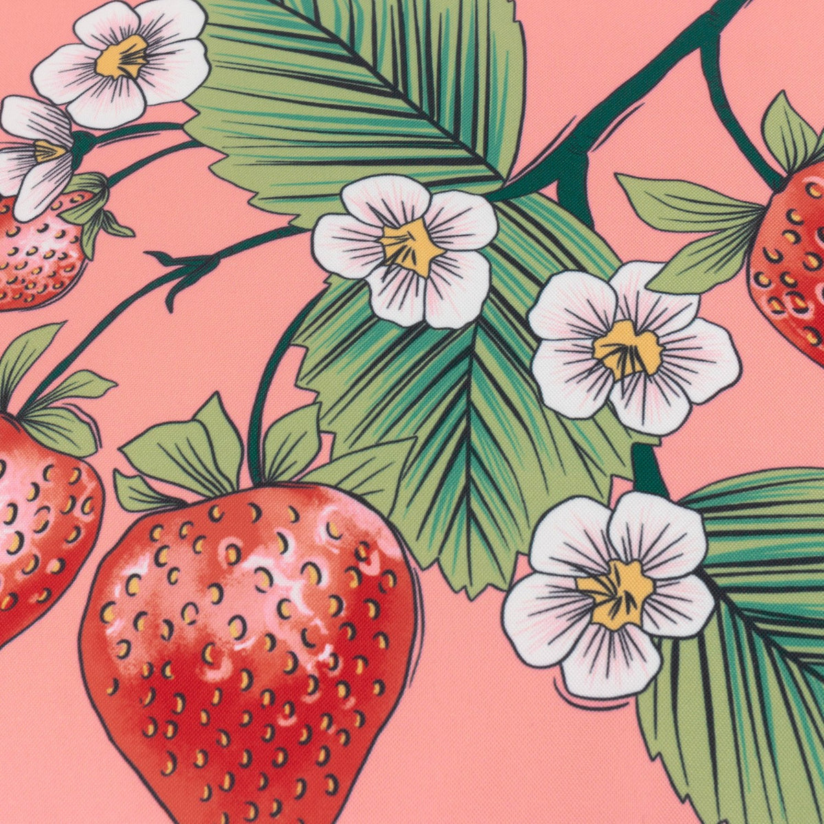 Anemone Reversible Polyester Cushion in a strawberry print design, showing red strawberries, white five-petalled flowers with yellow centres, and green leaves on a coral-pink fabric ground.