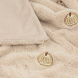 Autumn Pumpkins Velvet Faux Fur Throw in natural beige, close-up of plush pile with embroidered pumpkin motifs and soft velvet reverse edge.