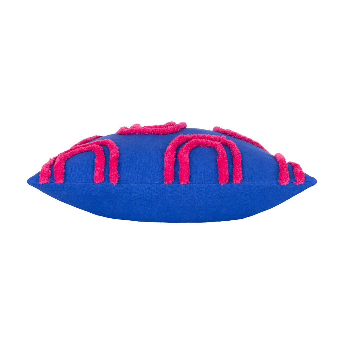 Archie Abstract Cotton Blend Cushion in cobalt blue with hand-tufted pink arch pattern, shown side-on against a plain white background.