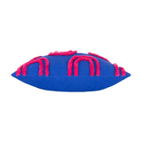 Archie Abstract Cotton Blend Cushion in cobalt blue with hand-tufted pink arch pattern, shown side-on against a plain white background.