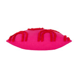 Archie Abstract Cotton Blend Cushion in pink, shown side-on, with tufted red arch and loop designs raised across the fabric surface, on a plain white background.