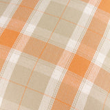 Close-up of the Arrochar Check Linen Cushion in Russet, showing a woven tartan check in orange, sandy taupe and off-white on a cotton-linen blend fabric.
