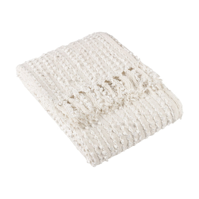 Arvo Plain Cotton Throw in natural cream, folded to show textured vertical boucle rows and knotted fringe edge, on a plain white background.