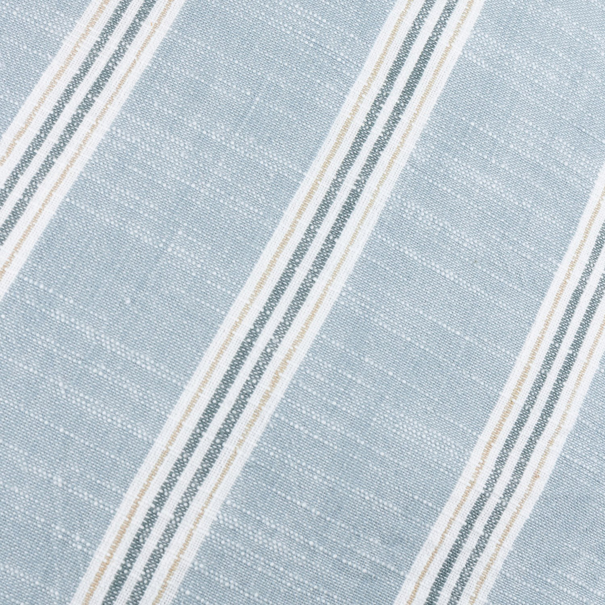 Close-up of the Abersoch Stripe cushion fabric in sail blue, showing diagonal woven stripes in white, sage green, and beige on a 100% yarn-dyed cotton ground.