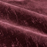 Close-up of Aurelio Chenille Jacquard eyelet curtain fabric in burgundy, showing soft folds and a subtle woven jacquard pattern with a dense, textured pile.