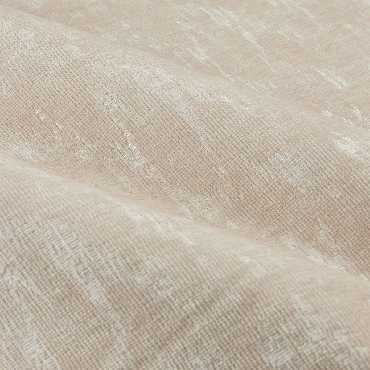 Close-up of the Aurelio Chenille Jacquard Eyelet Curtains in ivory, showing the soft nap and woven abstract pattern with subtle sheen across folded fabric.