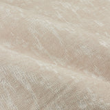 Close-up of the Aurelio Chenille Jacquard Eyelet Curtains in ivory, showing the soft nap and woven abstract pattern with subtle sheen across folded fabric.