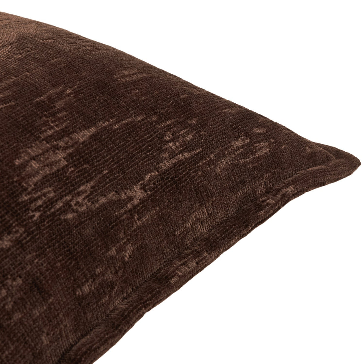 Close-up of the Aurelio chenille jacquard cushion in chocolate brown, showing a mottled abstract pattern and piped edge on a white background.