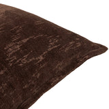 Close-up of the Aurelio chenille jacquard cushion in chocolate brown, showing a mottled abstract pattern and piped edge on a white background.