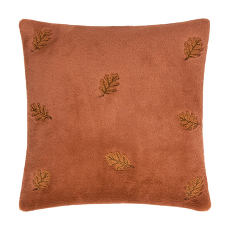 Autumn Trail Woodland Faux Fur Cushion in rust, square with plush pile and embroidered falling leaf motifs scattered across the surface, shown on a white background.