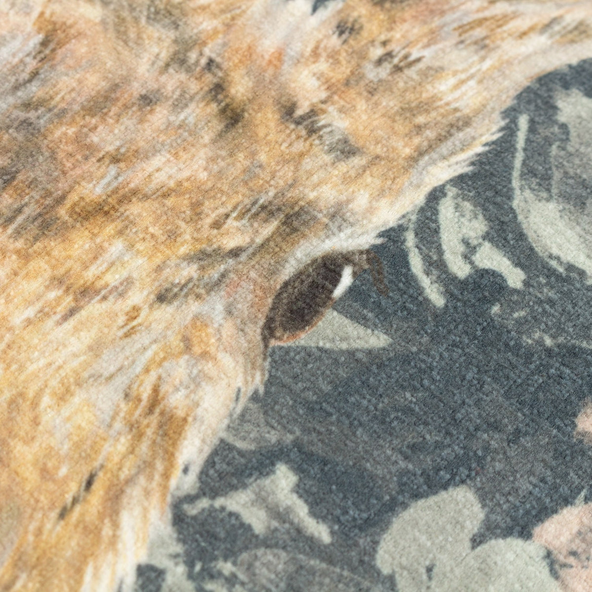 Close-up of the Avebury Animal Velvet Cushion in navy, showing the printed hare's eye and ear detail in tan tones against a dark floral velvet ground.