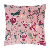 Aviary Velvet Cotton Cushion in Blushed Rose, a pink square cushion printed with birds and florals in red, green, teal and apricot tones, on a white background.