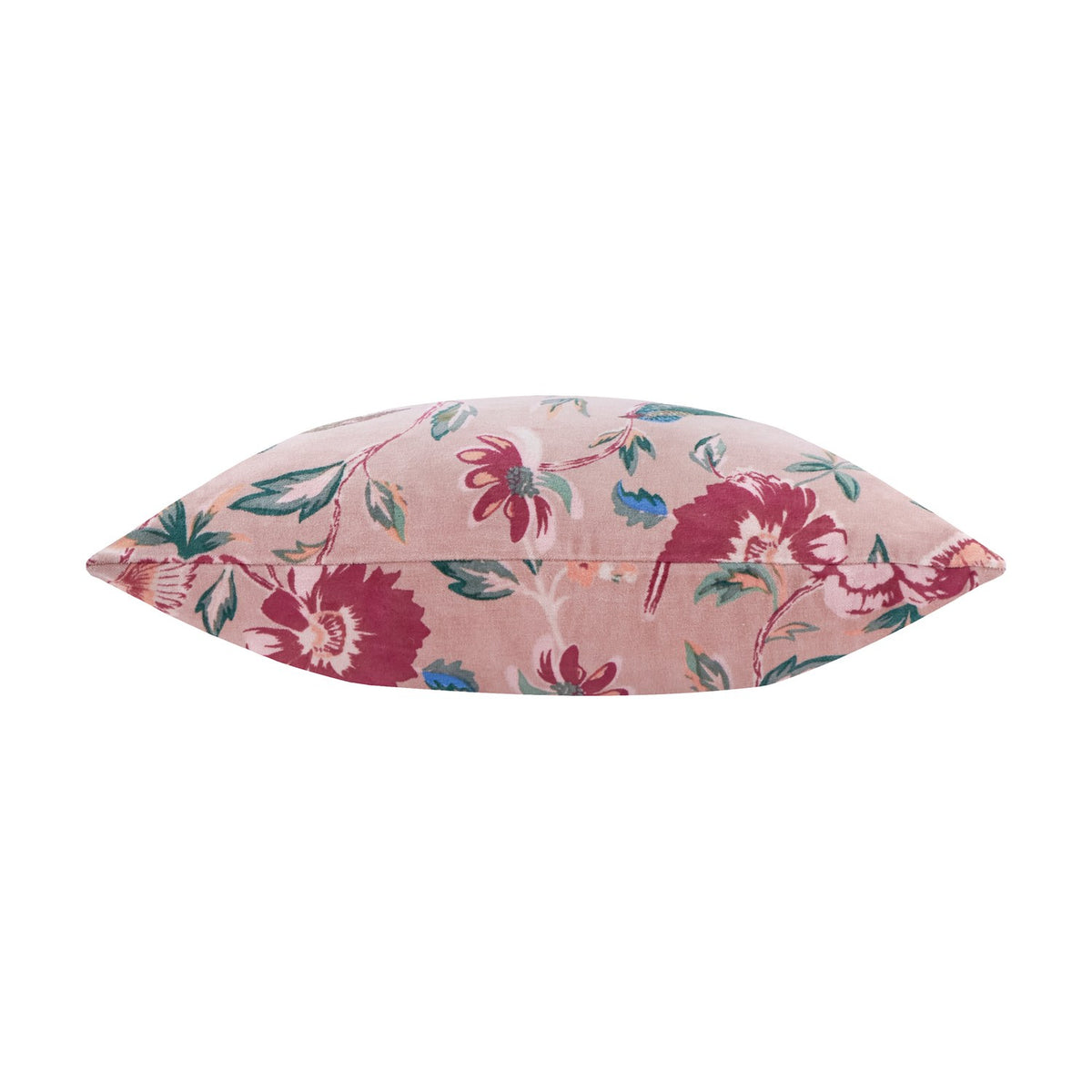 Aviary Velvet Cotton Cushion in Blushed Rose, shown side-on with floral print in reds, greens and teals on velvet fabric, plain white background.