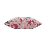 Aviary Velvet Cotton Cushion in Blushed Rose, shown side-on with floral print in reds, greens and teals on velvet fabric, plain white background.