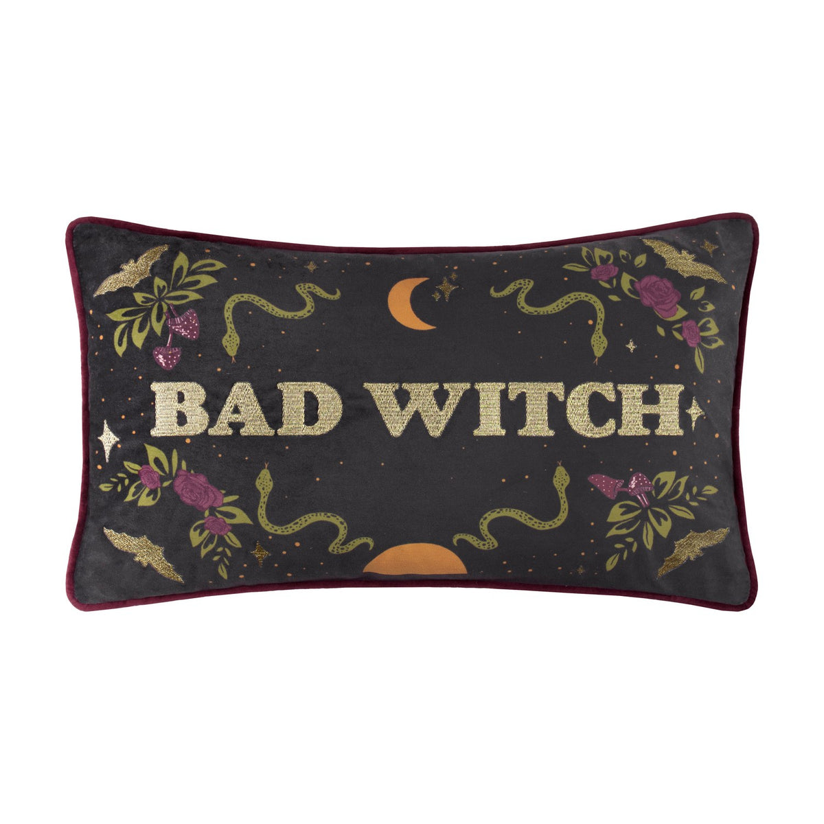 Rectangular velvet lumbar cushion in charcoal with burgundy piping, "Bad Witch" in gold embroidered lettering, surrounded by snakes, roses, bats and a crescent moon, on a white background.