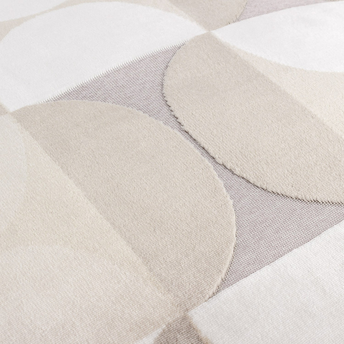 Close-up of the Bardot Geometric Velvet Cushion in Natural, showing cut-velvet circles and half-circles in beige, oatmeal and stone grey with a textured woven backing.