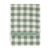 Folded Barton Gingham Cotton Towel in Forest, featuring a green and white check pattern with a plain green woven band, shown on a white background.
