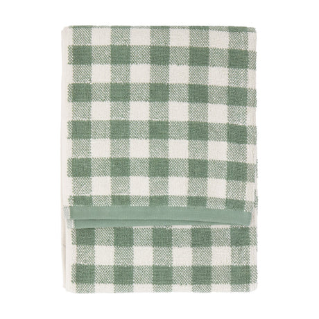 Folded Barton Gingham Cotton Towel in Forest, featuring a green and white check pattern with a plain green woven band, shown on a white background.