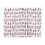 Beach Huts Printed Polyester Throw in multicoloured, featuring rows of illustrated beach huts in pink, blue, yellow and lilac on a cream ground, shown flat on a white background.