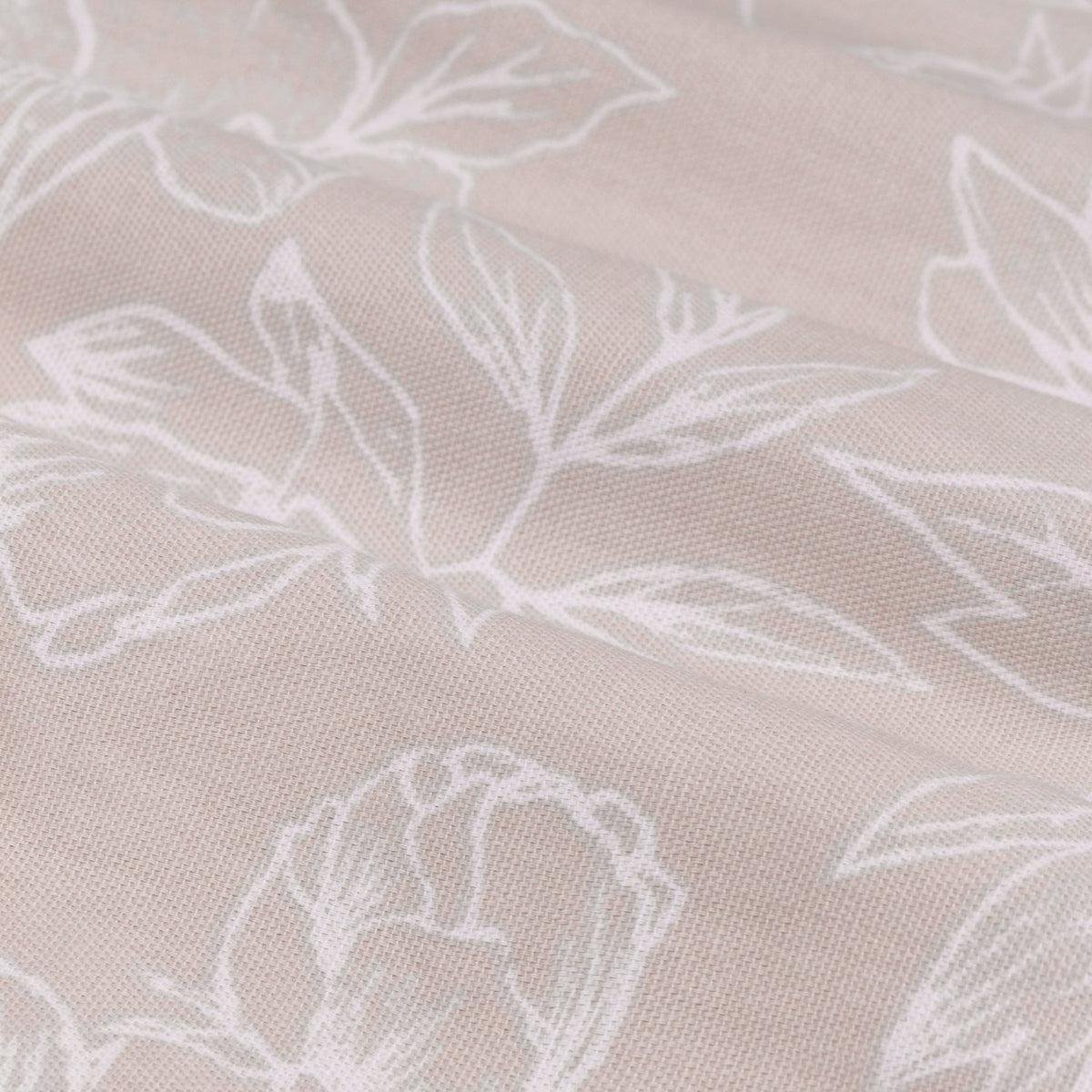 Close-up of Bella cotton eyelet curtain fabric in natural, showing fine white line-drawn floral and leaf outlines on a woven natural-toned ground.