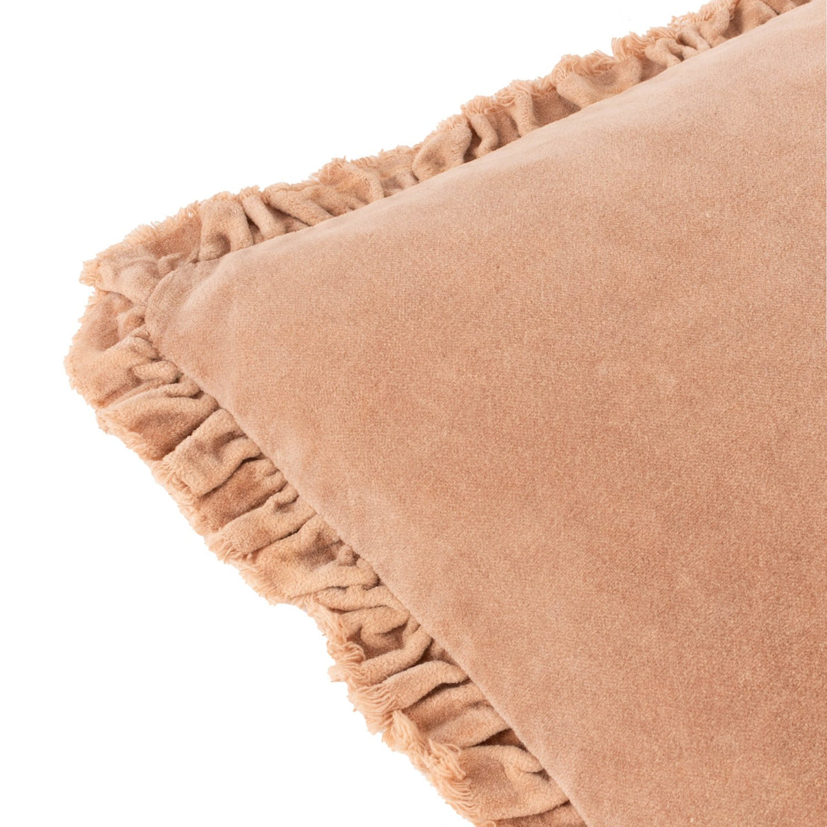 Close-up of the Bertie Velvet Cotton Cushion in peach, showing the frayed fringe edge trim and soft velvet pile against a plain white background.