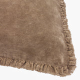 Close-up of the Bertie Velvet Cotton Cushion in chocolate brown, showing the dense velvet pile and frayed fringe edge on a plain white background.