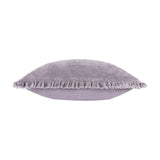 Bertie Velvet Cotton Cushion in mauve, shown edge-on with plain velvet faces and a frayed fringe trim along the seam, set against a white background.