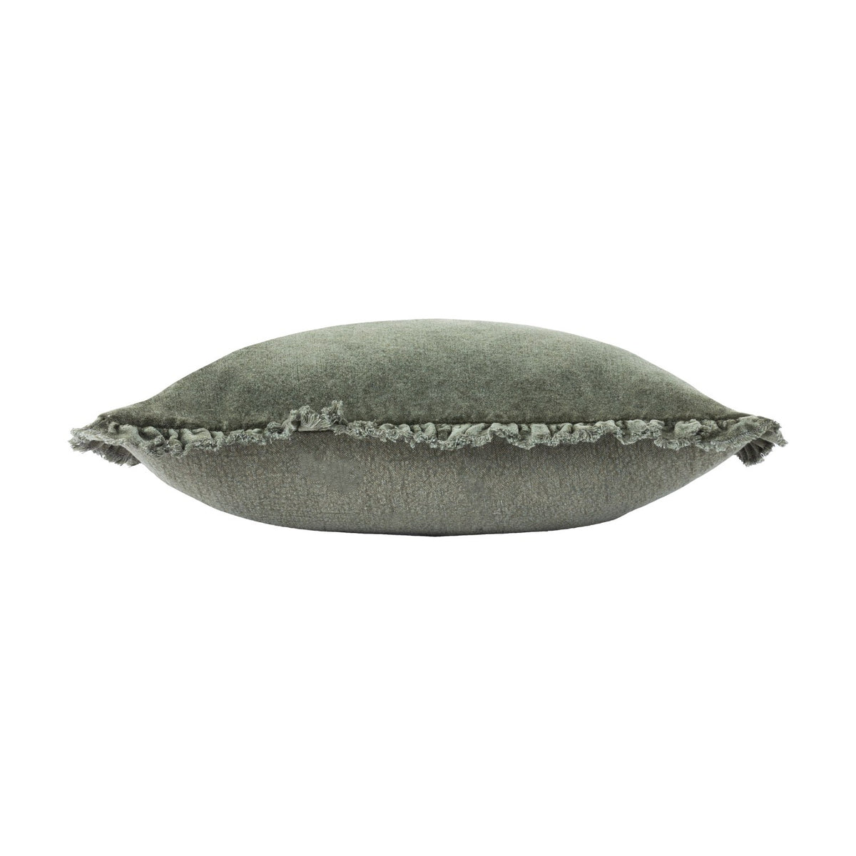 Side view of the Bertie Velvet Cotton Cushion in moss green, showing plump cotton velvet fill and a frayed fringed edge, set against a plain white background.