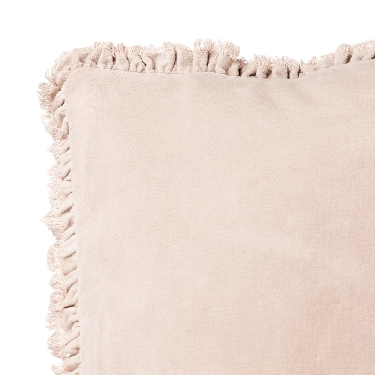 Close-up of the Bertie Velvet Cotton Cushion in natural, showing the soft cotton velvet face and frayed fringed trim along the edge against a plain white background.