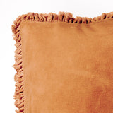 Close-up of the Bertie Velvet Cotton Cushion in rust, showing the fringed edge trim and soft washed velvet fabric against a plain white background.