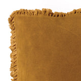 Close-up of the Bertie Velvet Cotton Cushion in saffron, showing the soft cotton velvet front and frayed fringed edge detail against a plain white background.
