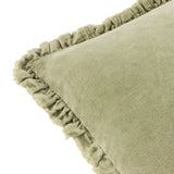 Close-up of the Bertie Velvet Cotton Cushion in light sage, showing the soft cotton velvet front and frayed edge trim on a plain white background.