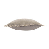 Side view of the Bertie Velvet Cotton Cushion in pale grey-taupe, showing its plump square shape and frayed, ruched edge trim against a white background.
