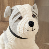 Close-up of the Bestie Dog Waffle Cotton Door Stop in natural, showing its bulldog-style face with grey ear and coat markings, black collar, and stitched muzzle detail.