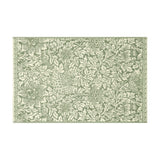 Rectangular cotton bath mat in the Bird and Anemone design, sage green birds, anemone flowers and foliage on a cream ground with a scrolled border, shown on a white background.