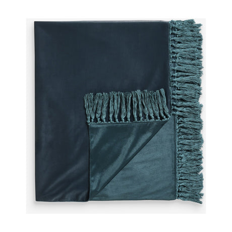 Bloom Plain Velvet Throw in dark teal-green, folded to show smooth velvet pile and reverse side, edged with a knotted tasselled trim, on a plain white background.