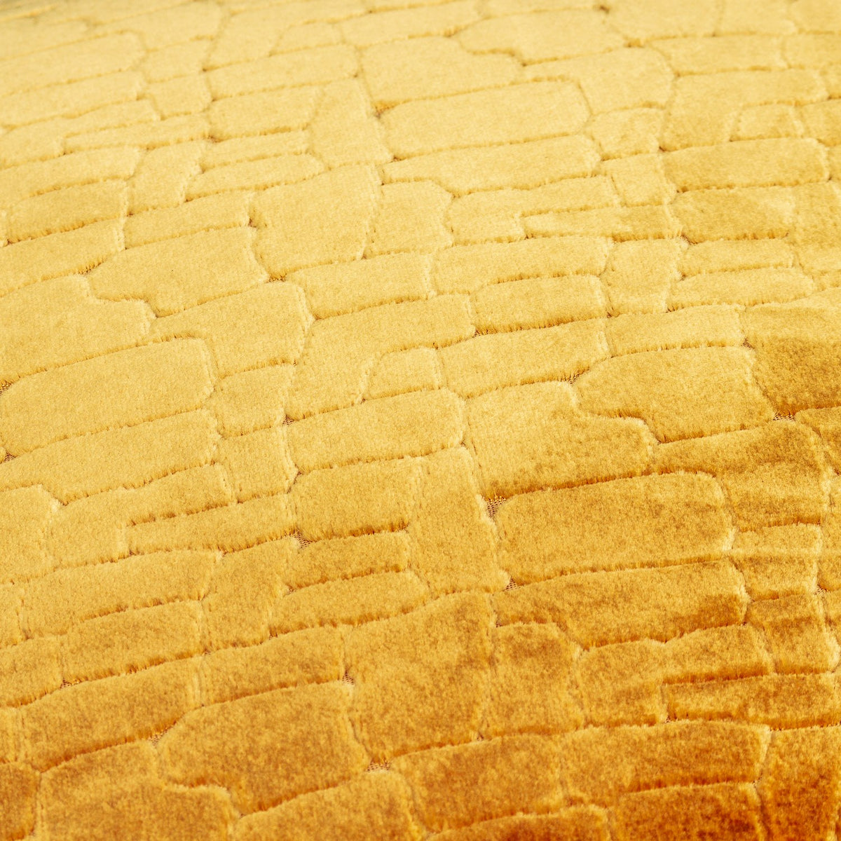 Close-up of the Bloomsbury Abstract Velvet Cushion in mustard, showing cut velvet pile in a raised geometric mosaic pattern with light-to-dark gold shading.