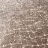Close-up of the Bloomsbury Abstract Velvet Cushion in taupe, showing cut-velvet pile carved into an irregular cellular pattern with contrasting light and shadow.
