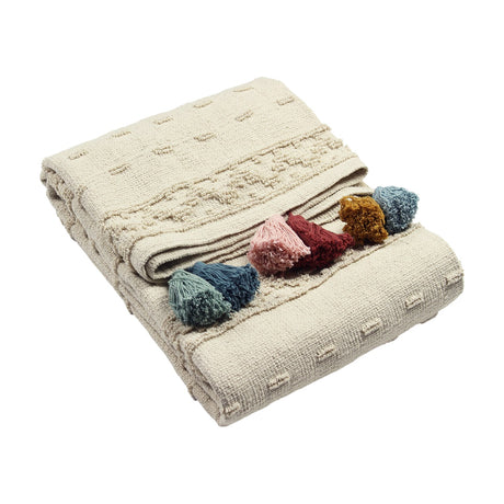 Boho Geometric Cotton Throw in natural cream with tufted geometric bands, folded to show multicoloured tassels in pink, red, mustard and blue, on a plain white background.
