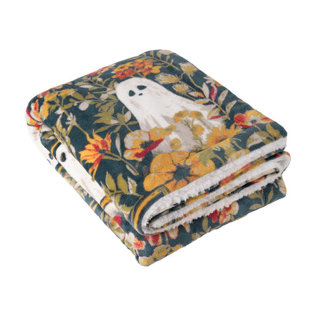 Folded Bootanical Floral polyester throw in deep teal with gold, rust and cream floral print and ghost motifs, sherpa fleece reverse visible, on a plain white background.