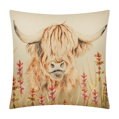 Bramble Highland Cow polyester cushion, 43 x 43cm, with a printed highland cow in soft ambers and browns amid rust-red wildflowers on a beige ground, shown against a plain white background.