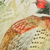Close-up of the Bramble Pheasant polyester cushion showing a hand-painted cock pheasant with red face and copper breast amid watercolour ferns and grasses.