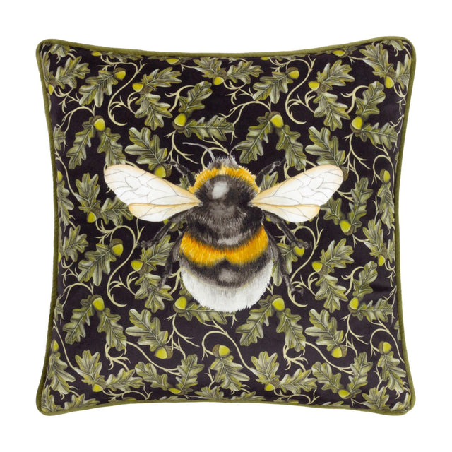Braywick Animal Velvet Cushion in the Bee design, a square black cushion with a printed bumblebee motif amid oak leaves and acorns, finished with green piping, shown on a plain white background.