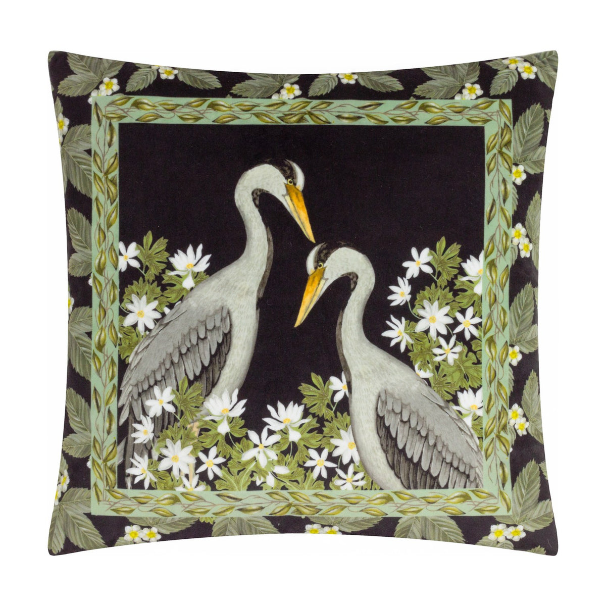 Braywick Animal Velvet Cushion in black polyester velvet, printed with two grey cranes facing each other, bordered by green leaves and white flowers on a plain background.