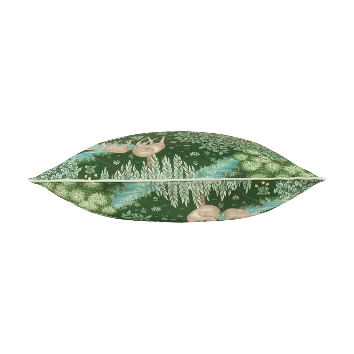 Side view of The Brook jacquard polyester cushion in forest green, showing deer and willow tree woodland design with piped edge trim on a white background.
